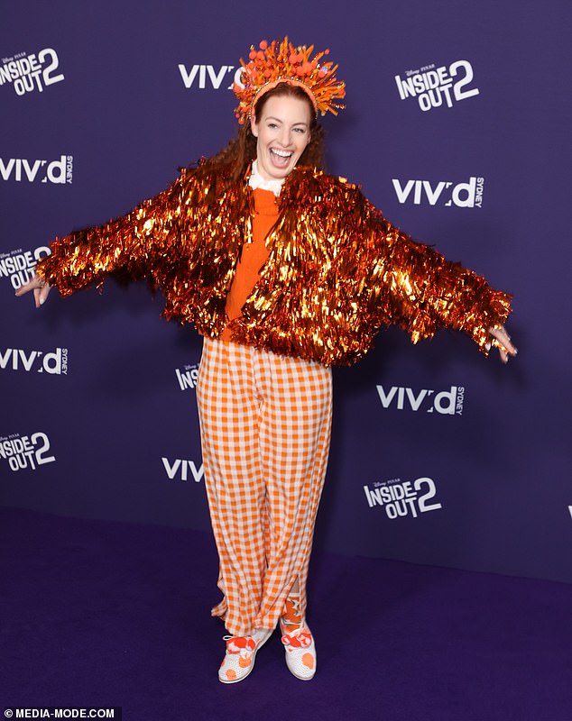 Also turning heads was former Wiggles star Emma Watkins (pictured), who couldn't be missed in a bright orange ensemble including a tinsel jacket and crown.