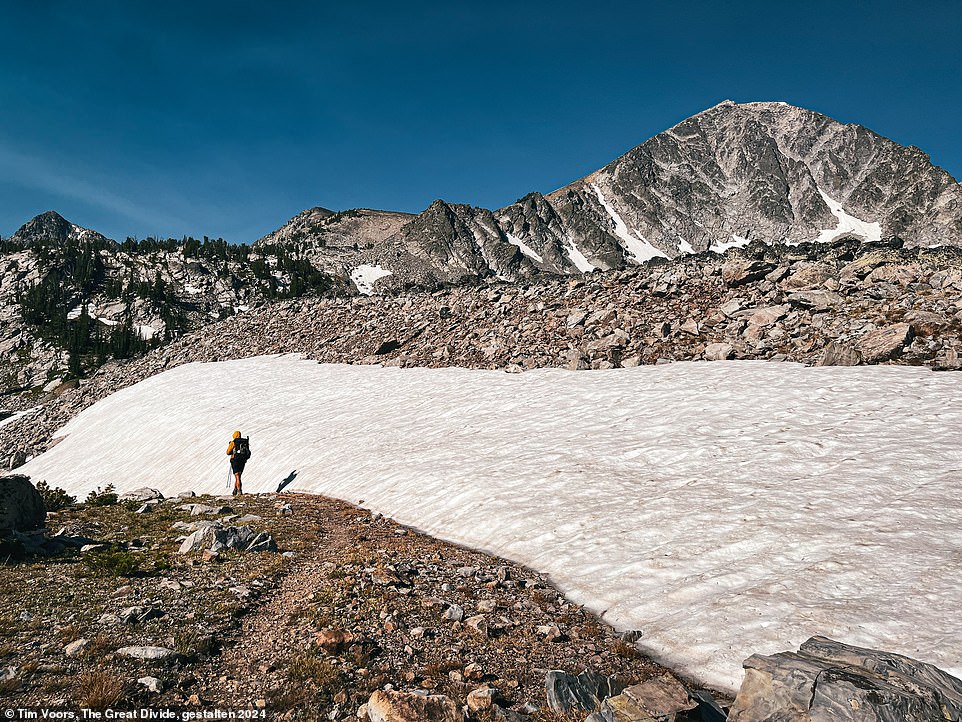 The trail disappears beneath a snowfield in this fascinating photograph taken near Leadore, Idaho.