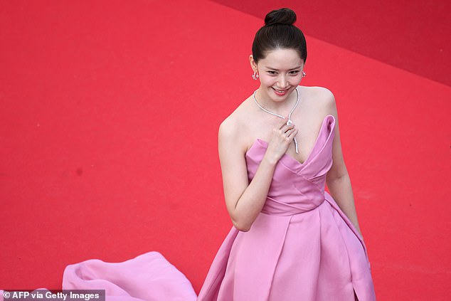 The K-pop star-turned-actress, 33, was preparing to pose for photos on the iconic red stairs when she was stopped by the security guard.