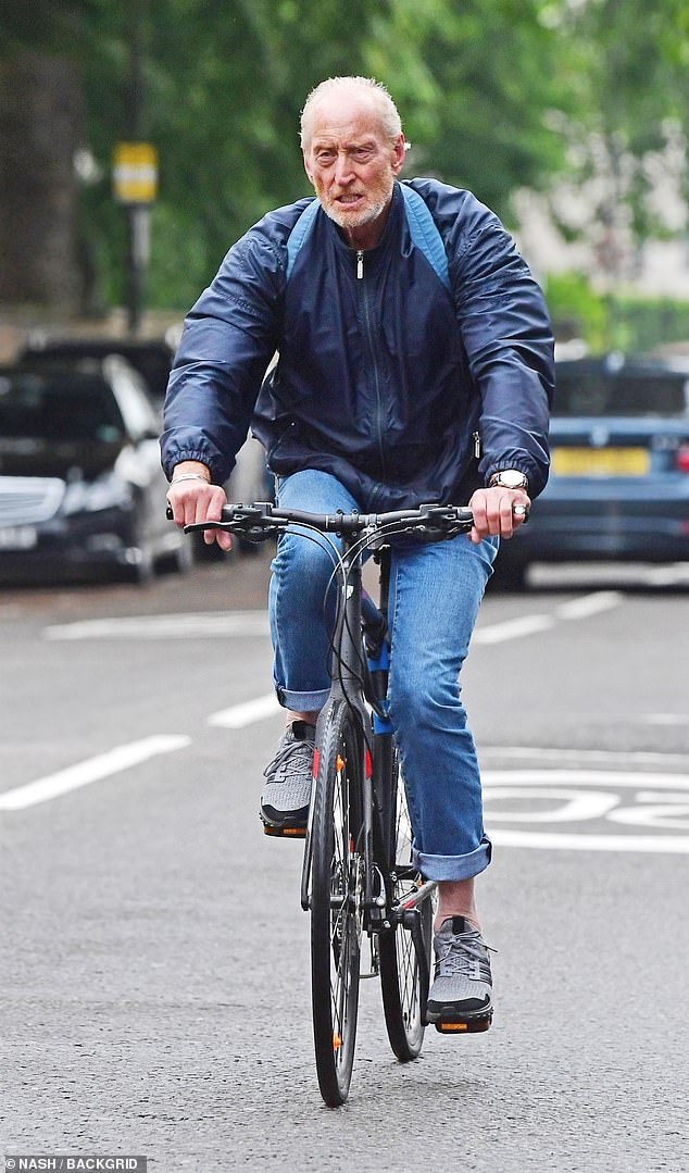 Pictured: Game of Thrones actor Charles Dance seen cycling through the streets of Camden in 2019.