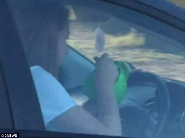 A Hungry teenage driver (pictured) has been fined $300 after she was photographed eating cereal behind the wheel in Perth.