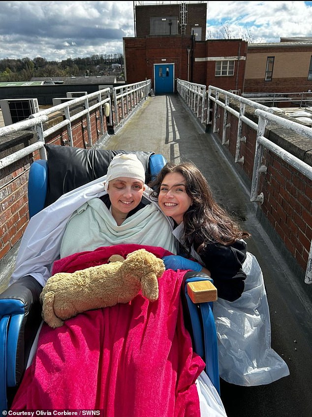 Olivia (left) with her sister Phoebe at Northern General Hospital 2 days after returning to England on April 4.