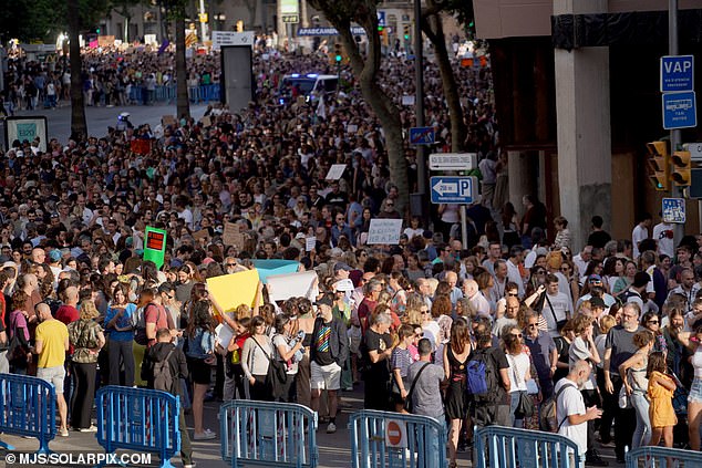 An estimated 15,000 locals joined the protest that passed through the capital, Palma, and headed to Plaza Weyler, where tourists came out for dinner and drinks.