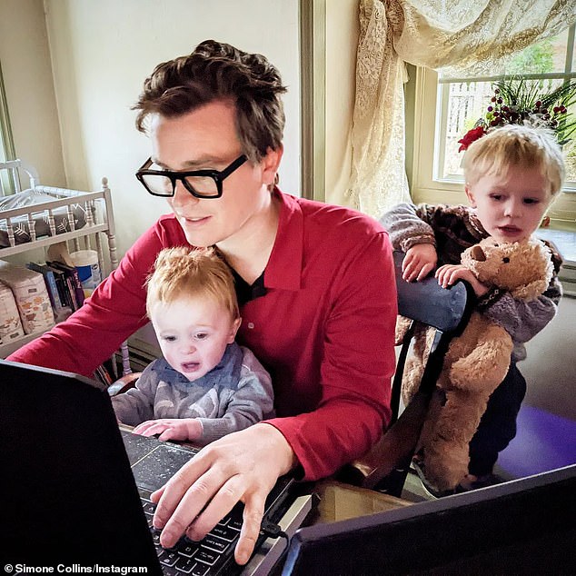 Malcolm working at home in Pennsylvania with two of his three children.