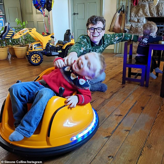 Malcolm playing with his children at his family's home in Pennsylvania