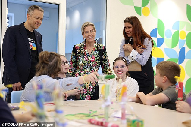 Sophie meets children during her visit to the NGO's family center 