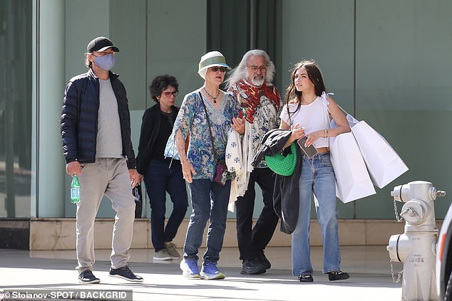 DiCaprio attempted to keep a low profile during the outing while sporting a black Dodgers baseball cap, a blue face mask, a black puffer jacket and a gray T-shirt.