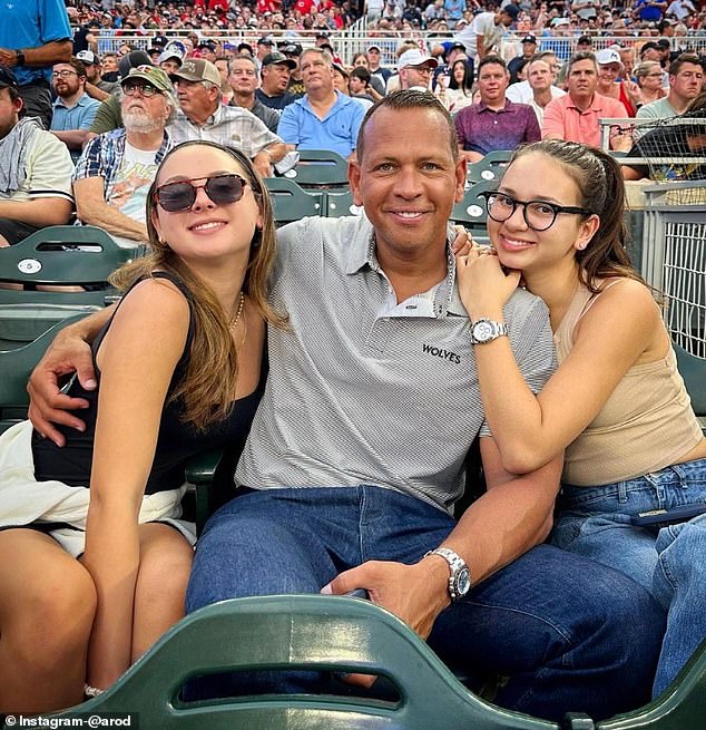 Rodriguez is seen with his daughters at a Minnesota Twins game last summer.