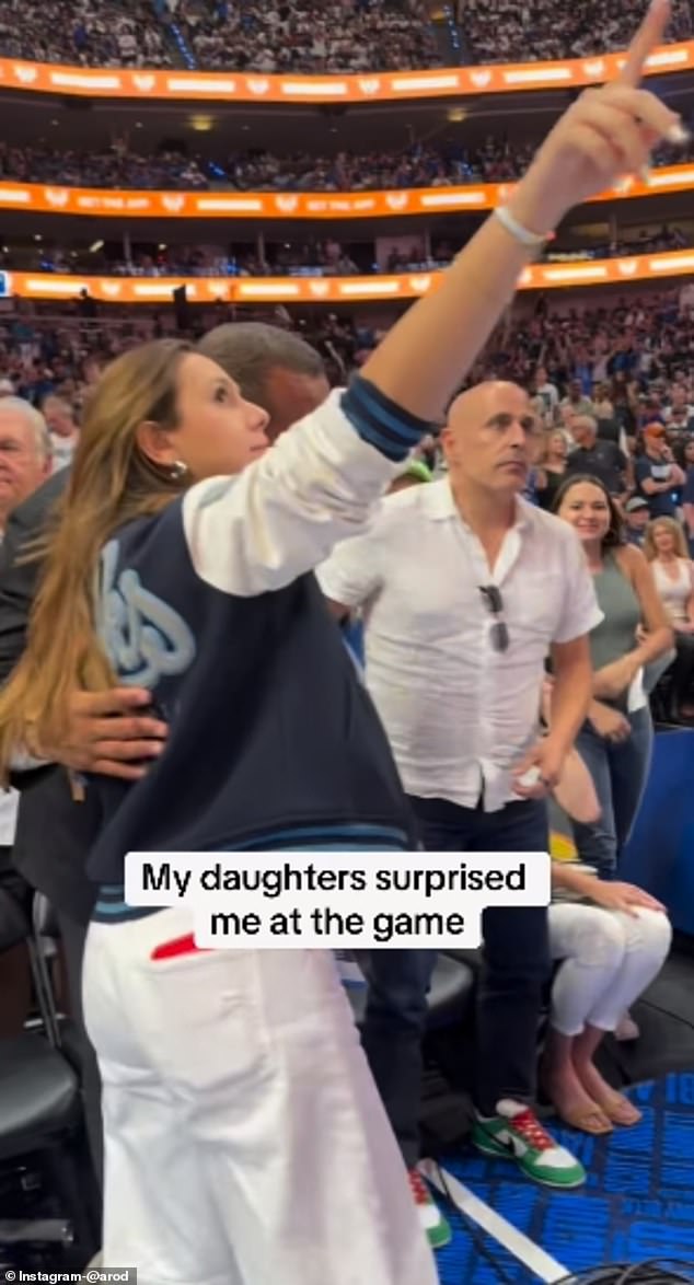 Rodriguez had been distracted earlier by his daughter Ella while pointing at the jumbotron.