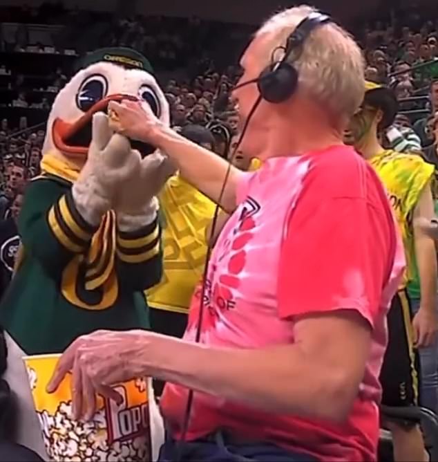 He also had a cheerful side: he was seen feeding popcorn to the Oregon Ducks mascot.