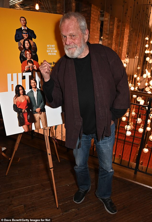 The Monty Python star struck a funny pose in front of the film's poster and arrived in a completely casual outfit consisting of a jacket, T-shirt and jeans.