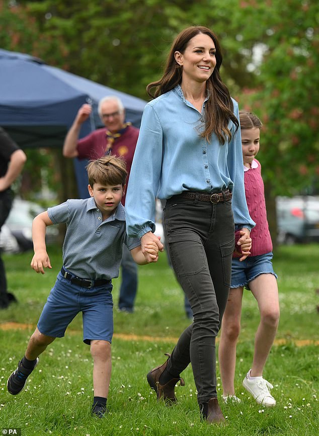 Kate with Louis and Charlotte in May 2023 as they helped renovate and improve Upton Scouts' third hut in Slough.