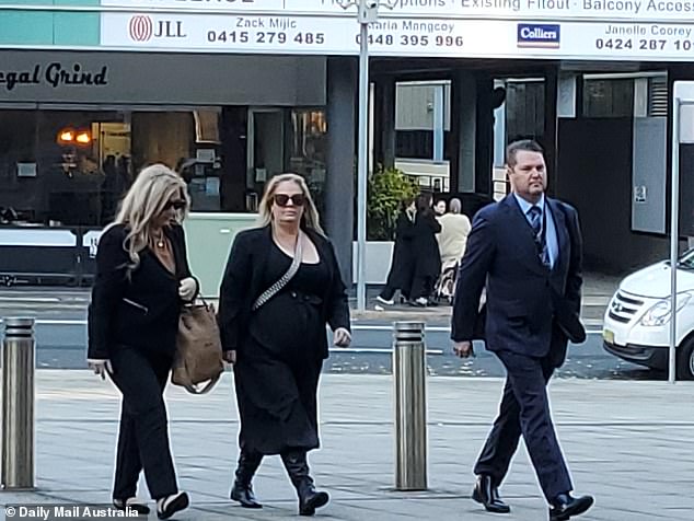 Kallista Mutten (center) arrives at court on Tuesday