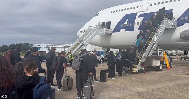 Two women are suing the Jaguars and their former kicker after alleging he sexually assaulted them on a team flight to London last year (pictured: Jaguars players boarding the flight).