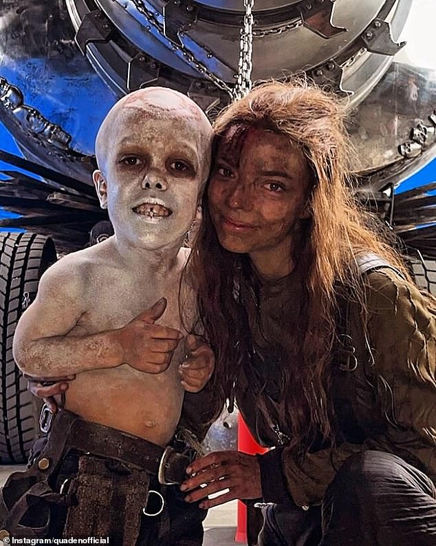 Quaden (left) on set as War Boy in the latest Mad Max film, Furiosa, with co-star Anya Taylor-Joy (right)