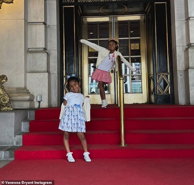 The girls posed in front of their hotel.