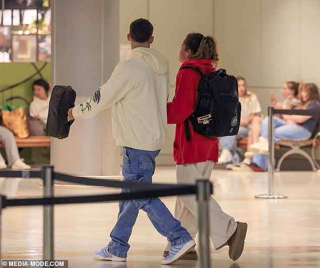 The pair held hands as they strolled through the terminal, and should reunite when Fowler returns to Sydney ahead of the Matildas' clash with China next Monday.