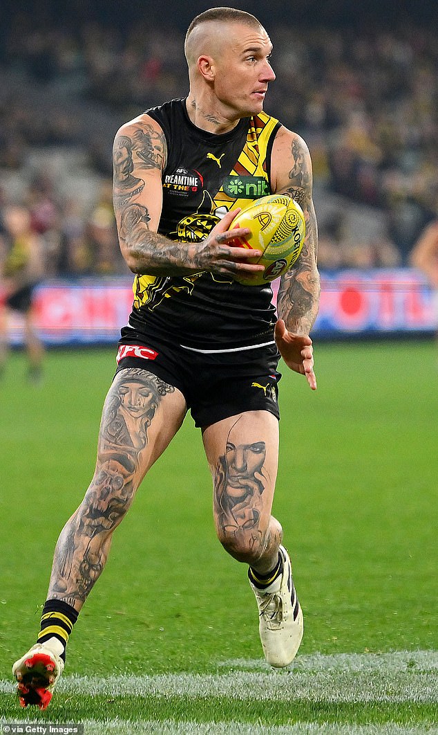 Dustin Martin made his AFL debut with the Tigers in 2010 and won three premierships (pictured in action against Essendon on May 25 at the MCG).