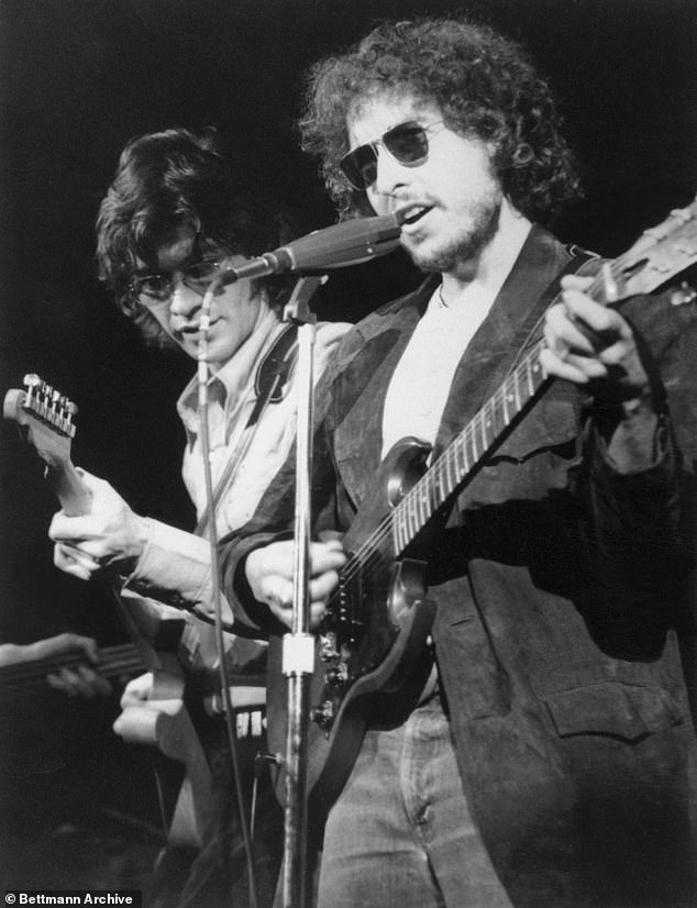 Robbie, a five-time Grammy nominee and Rock & Roll Hall of Fame inductee, is seen here shredding with Dylan in 1972, before becoming one of the founding members of The Band.