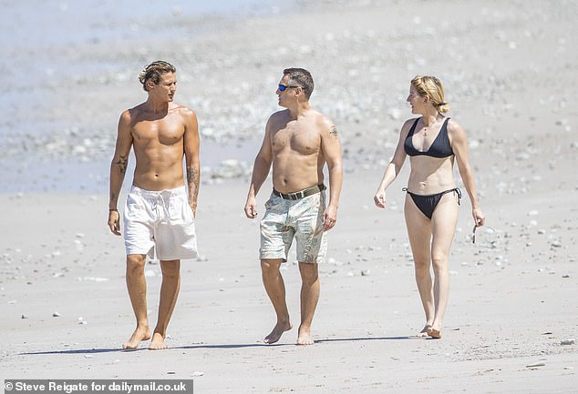 On Friday, a friend joined the beloved duo as they laughed and chatted while walking along Playa Hermosa beach, a long stretch of white sand surrounded by palm trees.