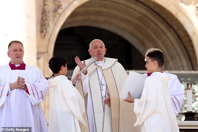 Pope Francis attends a mass in St. Peter's Square to mark the first World Children's Day on May 26