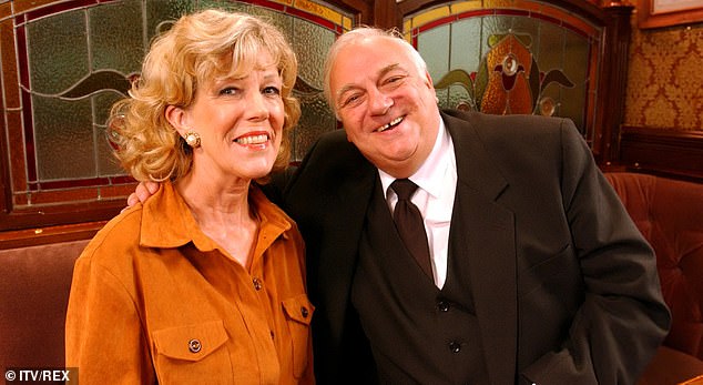 Roy, who played recurring character Archie Shuttleworth on Corrie between 2002 and 2010, died in 2020 aged 83 (pictured in 2002 with co-star Sue Nicholls (Audrey Roberts)