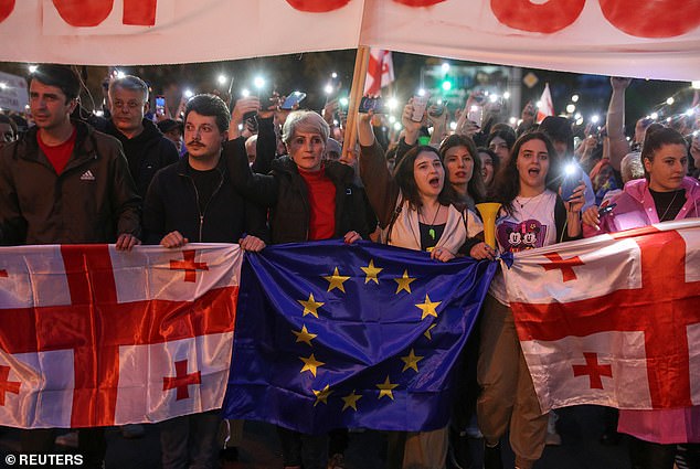 Protesters take part in a procession to protest against a bill on "foreign agents" and support Georgia's membership in the European Union