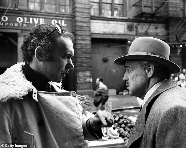 Ruddy (left) and actor Marlon Brando on the set of The Godfather, directed by Francis Ford Coppola, in Little Italy, New York, 1972