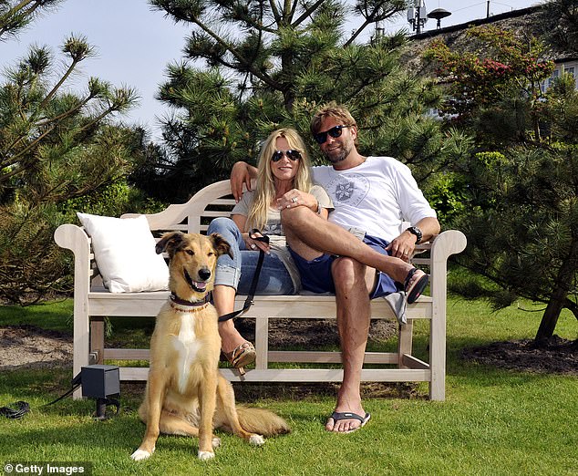 Klopp and Ulla, pictured with their dog Emma in 2013, moved in together after just three days.