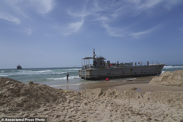 A US military landing craft stranded in Ashdod on Sunday, May 26, 2024, after being carried by wind and current from the temporary humanitarian dock in the Gaza Strip. (AP Photo/Tsafrir Abayov)