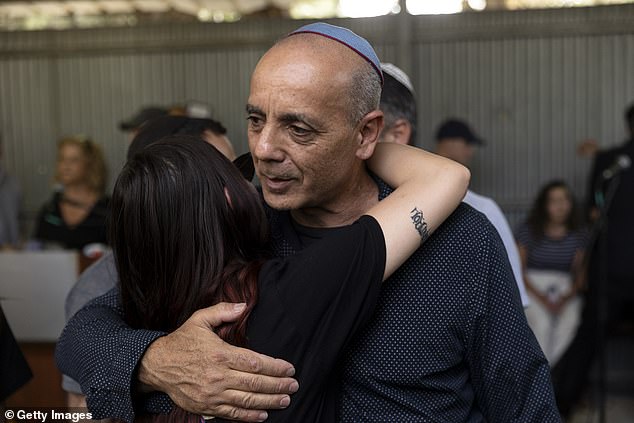 Nissim Louk reacts during the funeral of his daughter Shani Louk on May 19, 2024 in Srigim-Li On, Israel