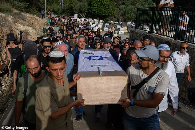 Atim Louk (L) was among the pallbearers carrying the coffin of his sister Shani Louk on May 19, 2024 in Srigim-Li On, Israel.