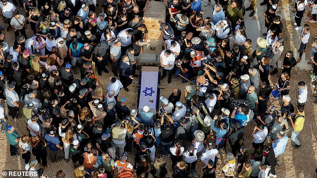 A drone view shows mourners during the funeral of German-Israeli Shani Louk, who was killed in the October 7 attack by the Palestinian Islamist group Hamas, in Srigim, Israel, on May 19, 2024.