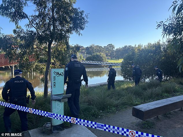 A crime scene was set up and the woman was urged to seek medical attention to get the necessary care for herself and her baby (pictured, police near the riverbank on Tuesday).