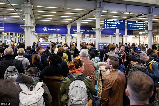 People queue for Eurostar train services at St Pancras International Station as they make their Easter getaway in London, Britain, on March 29, 2024.