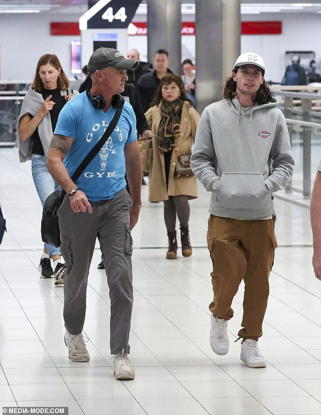 Blake, 21, also opted for a casual ensemble for the flight, sporting a gray Dickies hoodie and a pair of tan cargo pants.