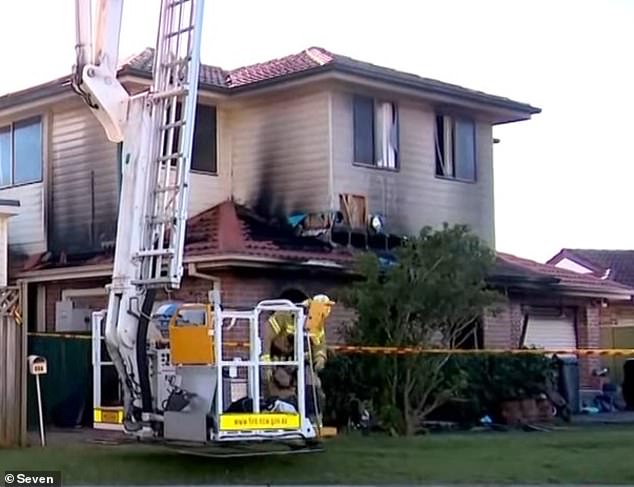 Firefighters were called to the scene after the fire broke out at the Macquarie Fields property (pictured) but the fire destroyed the two-storey house.