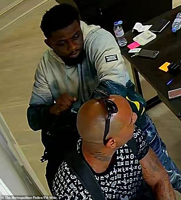 Two unarmed thieves (pictured) broke into the 247 Kettles store in affluent Richmond, south-west London, last Saturday and stole dozens of high-value watches.