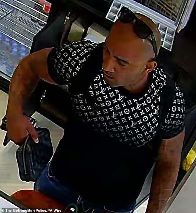 A CCTV image of one of the thieves who stole several high value watches from the store in Kew Road, Richmond.