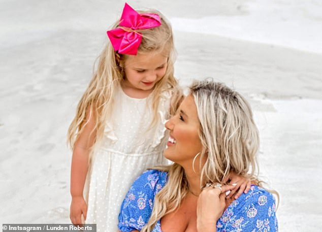 President Joe Biden and first lady Jill Biden didn't acknowledge they had a seventh grandchild until last summer. Lunden Roberts (right) and Navy Joan (left) pose for a photo