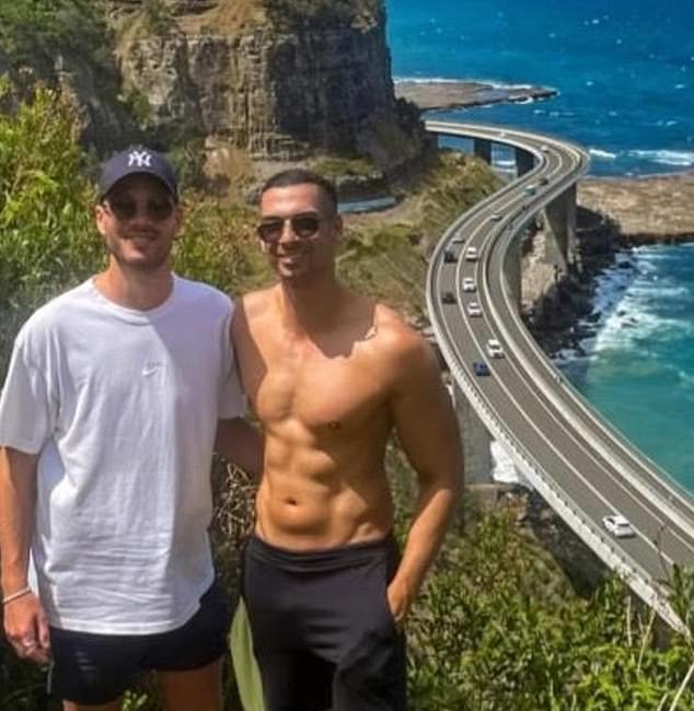 Another photo, taken at a viewing point overlooking the Sea Cliff Bridge on Grand Pacific Drive south of Sydney, shows a shirtless Lamarre-Condon with his arm around Mr Baird as they pose for a panoramic photograph.