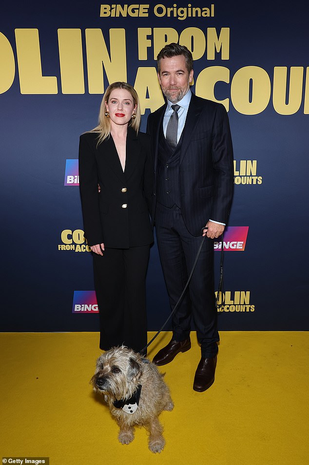 The Love Child star accessorized her look with a pair of chunky gold earrings as she posed with her husband Patrick and the show's main canine star, Colin.