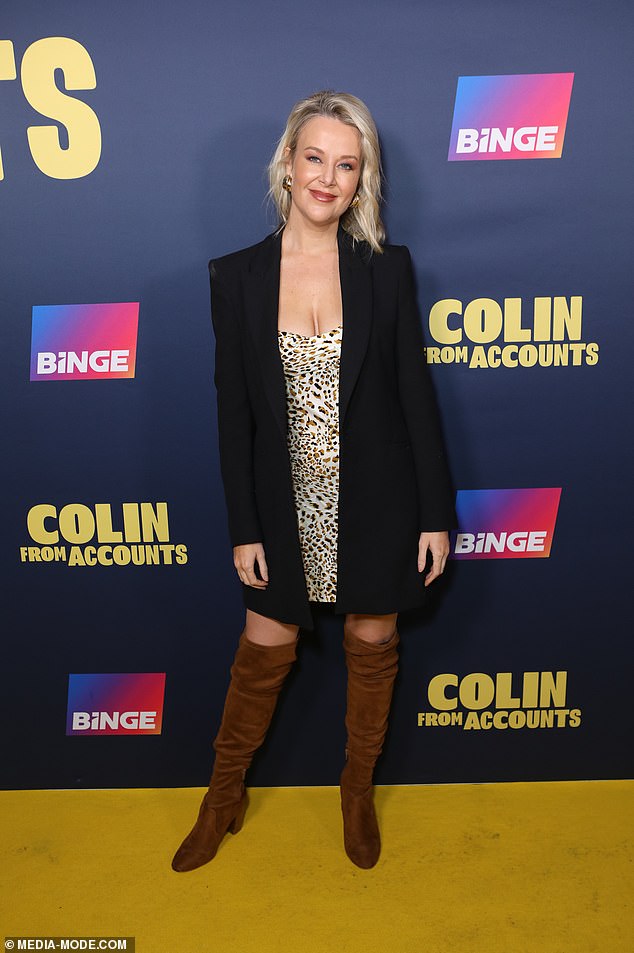 Jana Hocking showed her style with an animal print minidress and brown over-the-knee boots