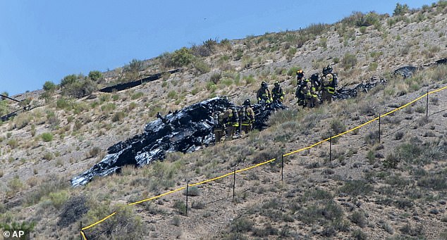 Emergency workers respond to the crash of a military aircraft near Albuquerque International Airport on Tuesday, May 28, 2024.