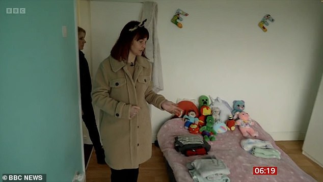 Mrs. Godrich and her three children sleep on mattresses on the floor of a room because their family home is infested with mold.