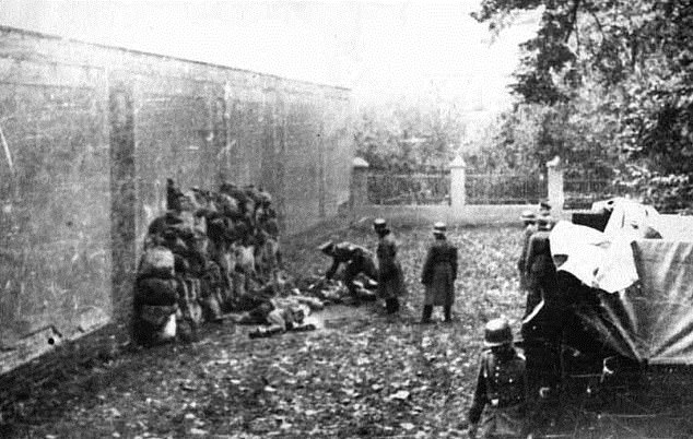 Nazi death squads are seen shooting Polish civilians in October 1939.