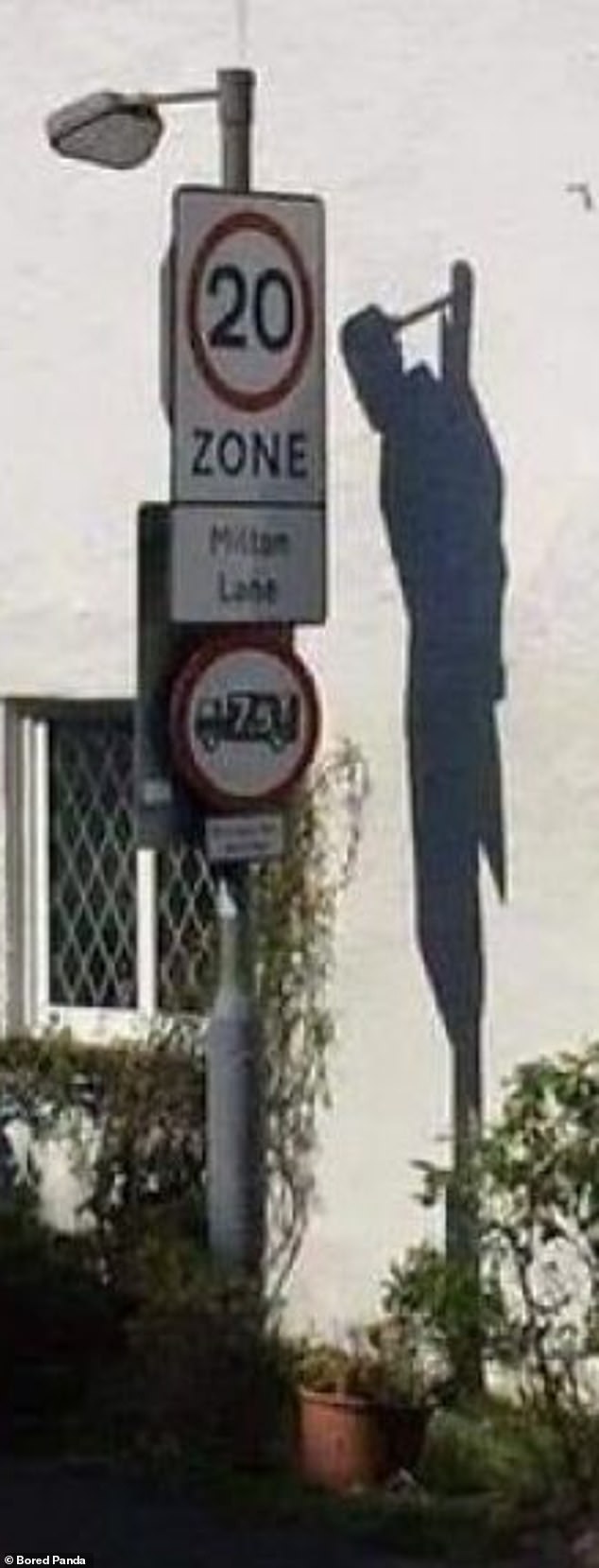 This sign, seen on a UK street, is not all that threatening in itself, however its shadow certainly looks creepy.