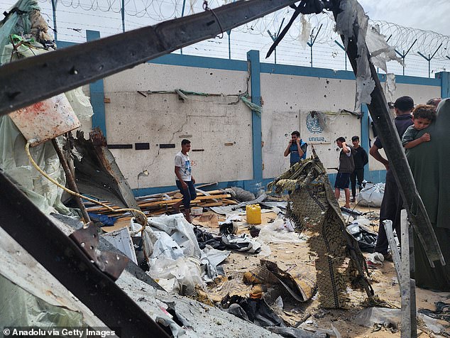 Palestinians examine makeshift tents destroyed after Israeli army attacks in Rafah, Gaza