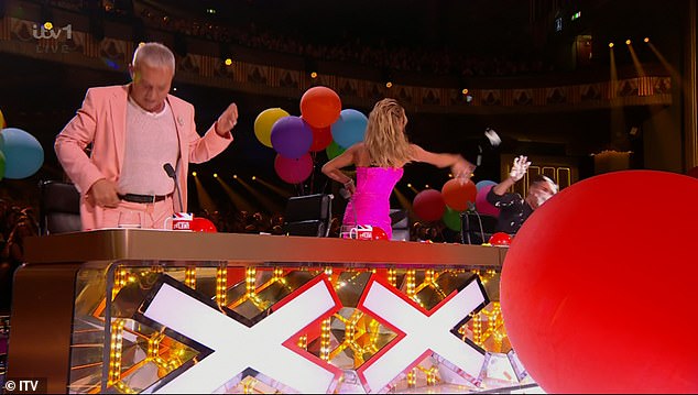 As Ant and Dec asked the judges for feedback, Simon took the opportunity to return the favor to Amanda as he threw a handful of cream at her.