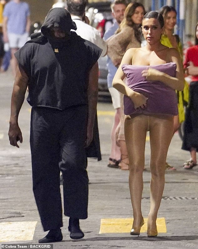 Kanye and Bianca Censori previously stepped out in Florence and Bianca again used a purple pillow to cover her breasts.